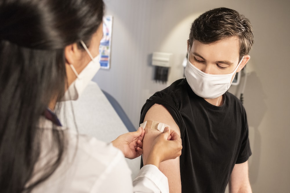 Nurse administering an immunization at an on-site clinic